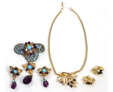 A Trifari paste and enamel necklace and earring suite, the necklace with a central cluster of leaves in cream enamel and blue
