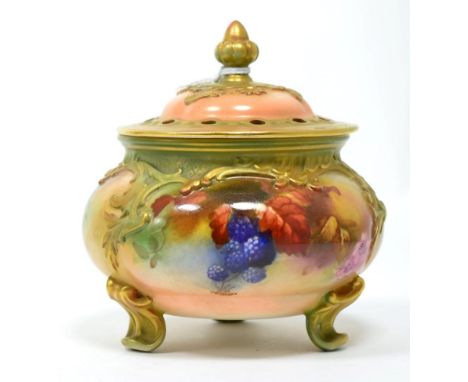 A Royal Worcester vase with pierced lid on three scrolled feet 