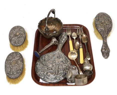 A silver hand mirror and brush; a pair of similar brushes; napkin ring; various spoons; pin dish etc 