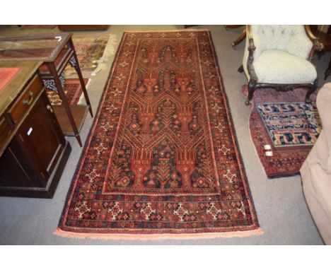 Modern Caucasian runner, central panel of geometric designs, mainly black and red field, 285 x 117cm