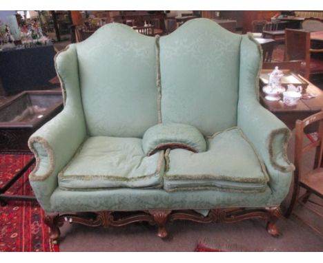 Early 20th century double arch back green upholstered two-seater sofa, 149cm wide
