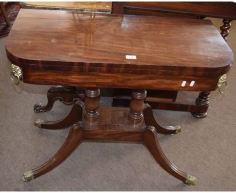 Regency period mahogany fold top card table applied throughout with brass mounts and ring handles and quadruped base 89cm wid