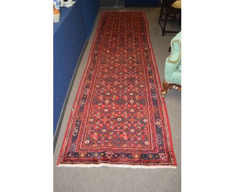 Modern Caucasian runner with multi-gull border, mainly red field, 420 x 107cm