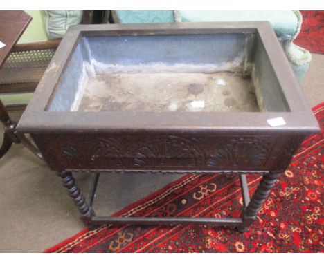 Oak planter of rectangular form with zinc lined interior, carved frieze on bobbin turned supports 71cm wide