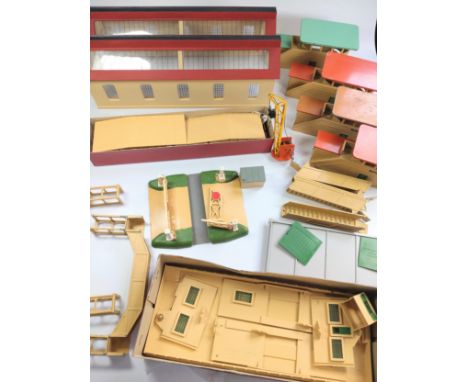 No 107.  Four Hornby-Dublo 5084 Signal Cabins (one with green roof, chips to rim), 5020 Goods Depot, Island Platform Kit, Lev
