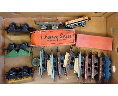 Hornby Series O gauge wagons including two McAlpine Side-Tippers, LMS Hopper, and Flat Trucks, two with boxes, varying condit