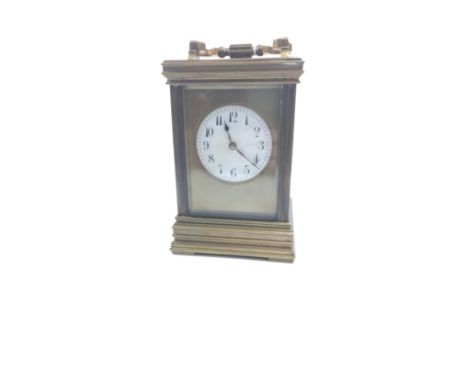 A Victorian Brass Carriage Clock. Circa 1890. The white enamel dial with Arabic Numerals. Striking on a gong. With key. 15cm 