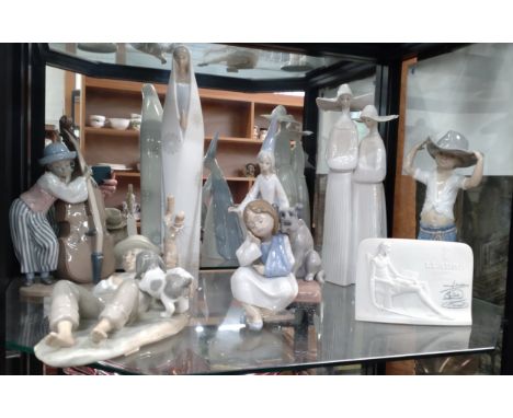 Five Lladro figures including Girl with Puppy 15cm, and a bisque Collectors Society plaque 15cm, and two Nao figures (8) 