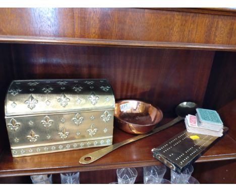 A brass cribbage board, a brass spoon, a copper bowl and a small brass chest 