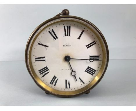 Antique clock, Brass cased drum mantel clock printed dial with Roman numerals marked EXD By MANN Bevelled glass approximately