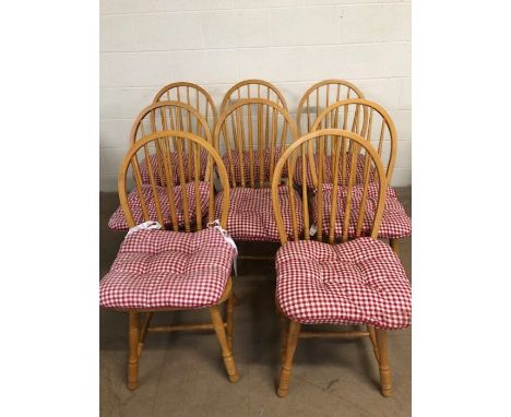 Furniture, set of 8 modern light wood Windsor spindle back dining chairs with red check material seat cushions.