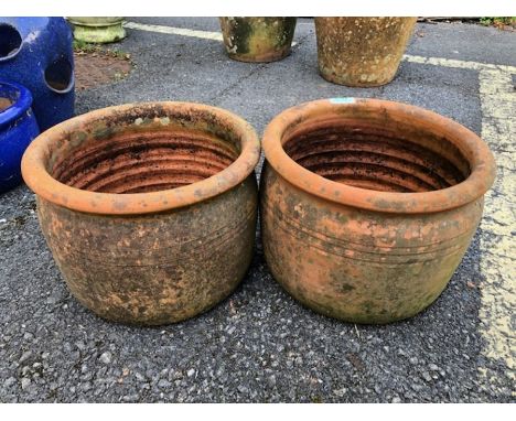 Pair of circular terracotta garden pots approx 20cm tall 