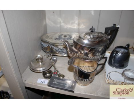 A plated floral embossed trinket box; a white metal chamber stick; a plated teapot and matching cream jug etc.