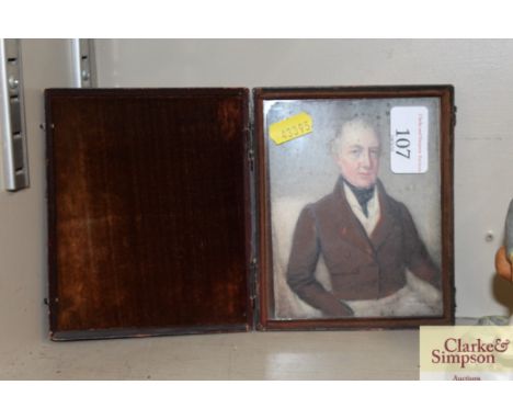 A 19th Century miniature portrait in folding leather frame 