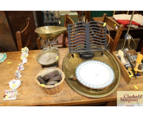 A quantity of brassware to include brass scales and weights; a brass tray; a copper plate warmer and cook book stand