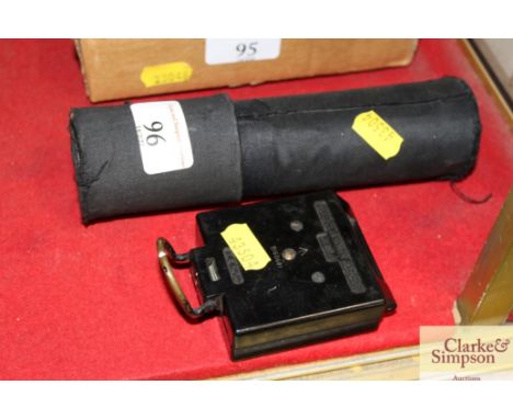 A three draw telescope in fitted case; and an ex War Dept. compass