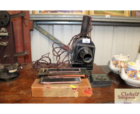 A Magic Lantern and a quantity of slides (slides to be viewed in cabinet)