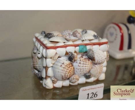 A sailor's Valentines shell decorated trinket box and contents to include a watch movement and various buttons 