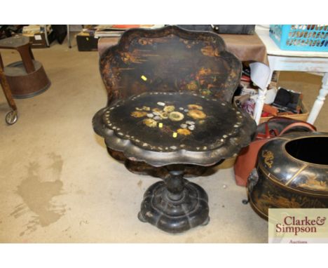 A large floral decorated Papier Mâché tray AF; and a mother of pearl inlaid and floral decorated Papier Mâché table