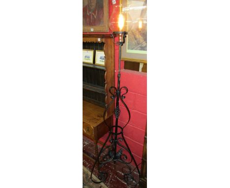 Adjustable wrought iron standard lamp in working order