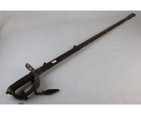 An Antique Infantry Officers Sword With Decorative Blade, Pierced Decorative Basket And Original Metal Scabbard. 