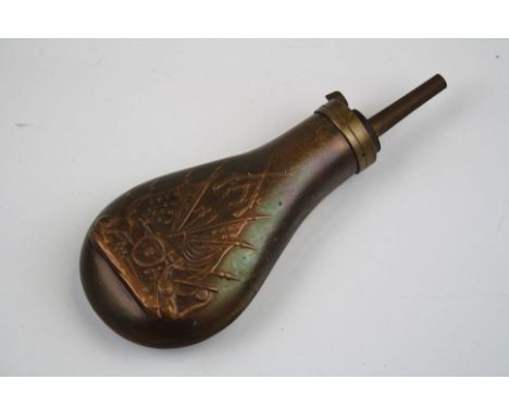 A Vintage Copper Powder Flask With Embossed Decoration Depicting American Flags, Cannons And Weapons. 