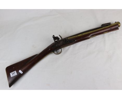 A 19th Century Brass Barrelled Flintlock Blunderbuss With Flared And Sighted Barrel Fitted With A Spring Loaded Bayonet, The 