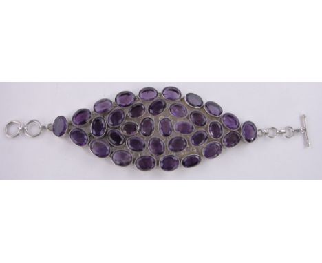 A large amethyst set silver bracelet c. 1970s,amethyst panel length 14 mm