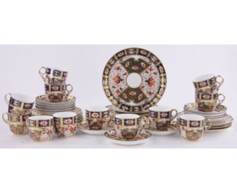 A Derby porcelain Imari pattern tea service c. 1900,comprising 12 cups, saucers & 6.75" side plates, & two 9" serving plates