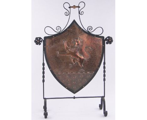 A Wrought iron & copper shield shape Heraldic fire screen,height 34", width 23"