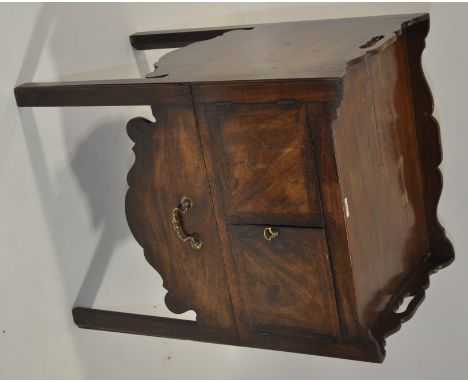 A George III mahogany tray top commode,width 1'11", height 2' 6", depth 1' 7"
