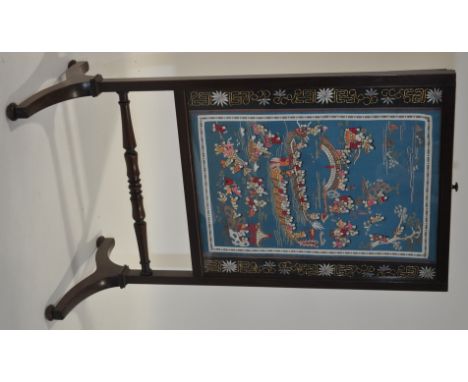 A 19th century mahogany fire screen,with an Oriental silk panel depicting figures in a boat, on turned legs