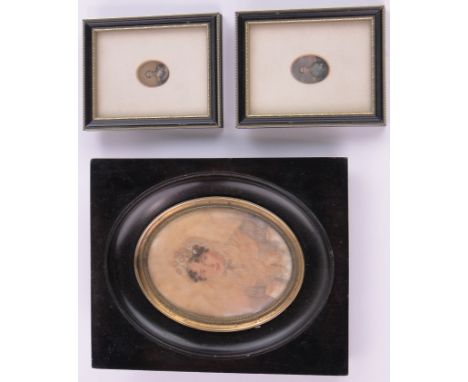 A 19th century miniature watercolour portrait of a woman,unsigned, in ebony frame, height overall 8.5", together with a pair 