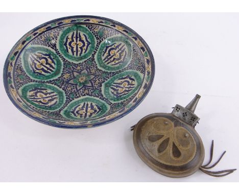 A large Moroccan painted pottery dish 14.5" across, & a Moroccan leather water flask (2)