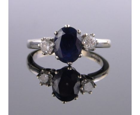 An 18 ct gold 3 stone sapphire & diamond ring,sapphire height 9 mm, size R