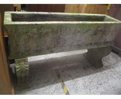 A large stoneware garden trough planter decorated with figures and horses, raised on bulbous shaped pedestals, 72cm x 129cm w