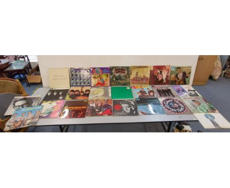 A collection of 24 1960/70's vinyl records to include The Rolling Stones 'Beggars Banquet', The Beatles 'Hard Days Night', 'W