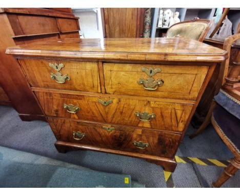 A late 18th/early 19th century walnut chest of two short over two long drawers, raised on bracket feet 80cm h x 92cm w x 48cm