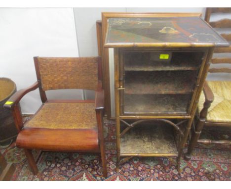 A late 19th century chinoiserie and bamboo cabinet with a coloured, lacquered top, over a glass door and shelf, A/F and a col