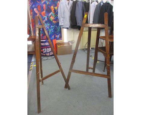 Two varnished vintage wooden easels approximately 120cm h (painting not included) Location: RWM 