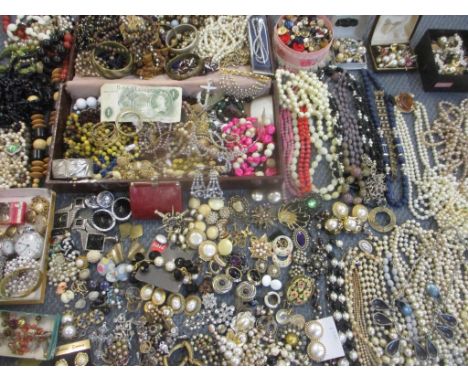 A large collection of 20th century costume jewellery to include pearl and faux pearl necklaces, costume rings, watches A/F, v