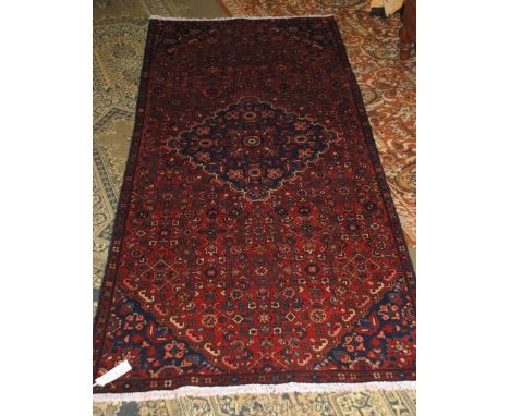 A fine hand made woollen Hamadan Runner with overall floral design, 260 cms x 113 cms.