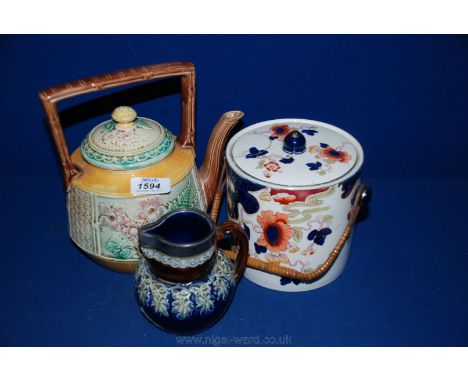 A Royal Worcester oriental style Teapot with flower and fern decoration, Royal Doulton Jug with white metal rim and a Loselwa