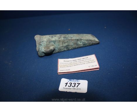 A good bronze age north European looped and socketed axe head. Old sale ticket recording provenance to a Dutch collection.