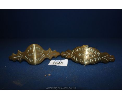 Two Brass name Plates for horse harnesses, 'James, maker Hereford' and 'R. Vaughan, maker Talgarth', as found