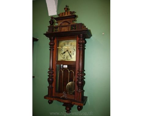 A Vienna style Wall Clock, with key and pendulum