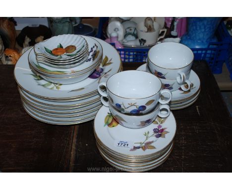 A Royal Worcester ''Evesham'' part Dinner service including eight dinner plates, four scallop dishes, four soup cups with sta