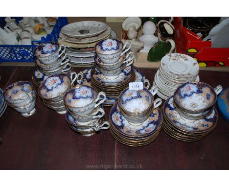 A pretty Tea and Coffee Service including eleven tea cups, eight coffee cups, twenty tow saucers and a bread and butter plate