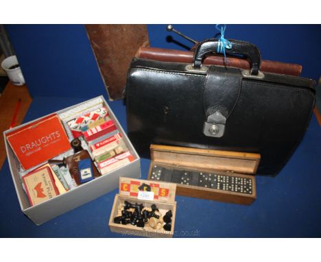 A quantity of Games including draughts board, a/f, wooden box of draught pieces, playing cards and five coloured dice, leathe