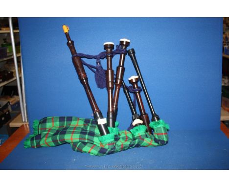 A set of Bagpipes, as new, retailed by Piob Mhor of Scotland, made with Barclay tartan, and with Canmore pipe bag, and carryi